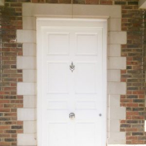 white cast stone door surround