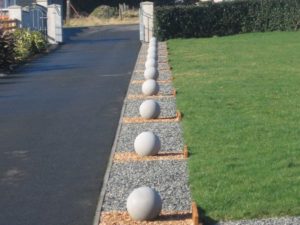 cast stone spheres in a garden